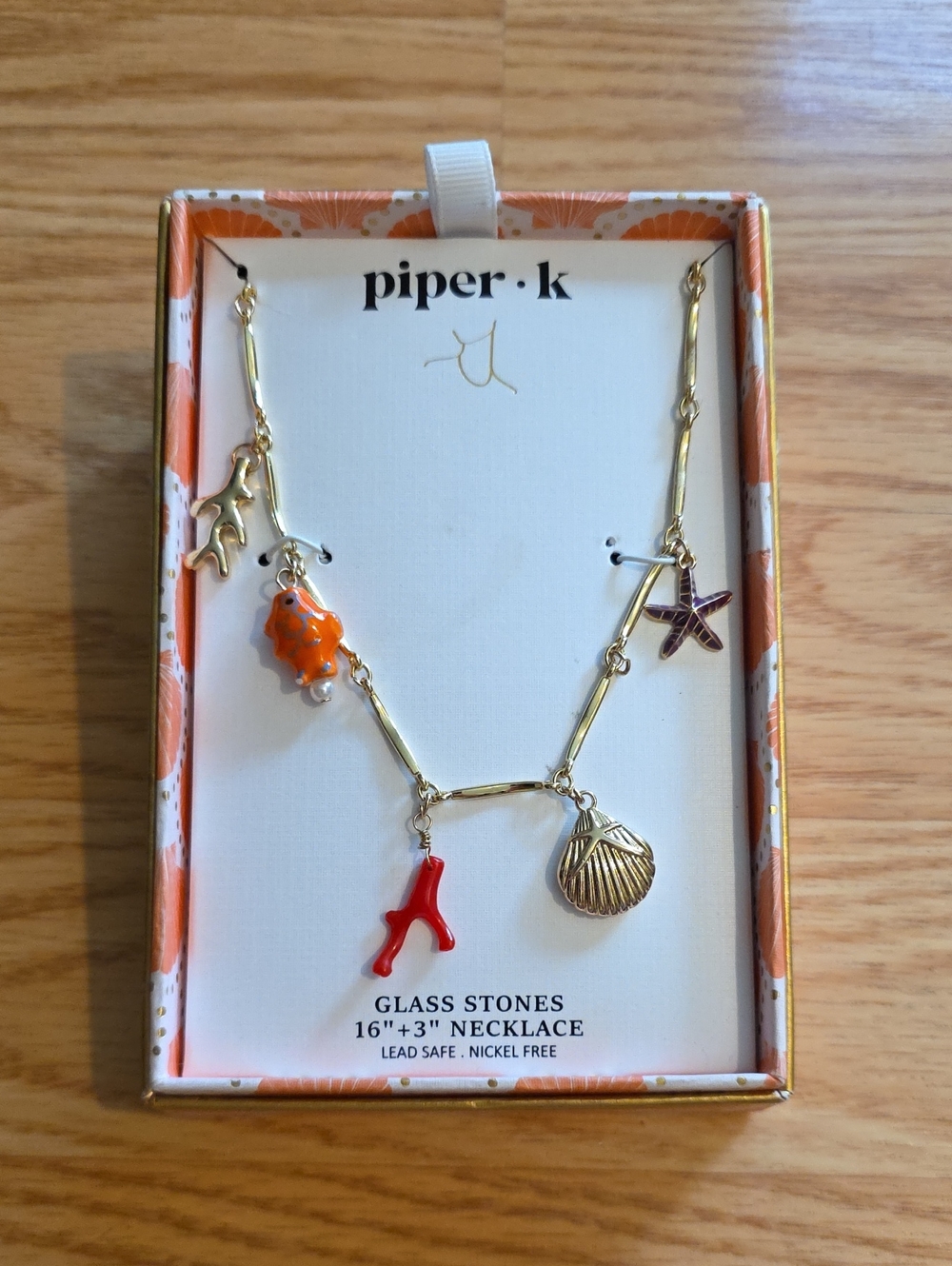 piper·k Gold-tone Ocean Charm Necklace with Orange and Red Accents